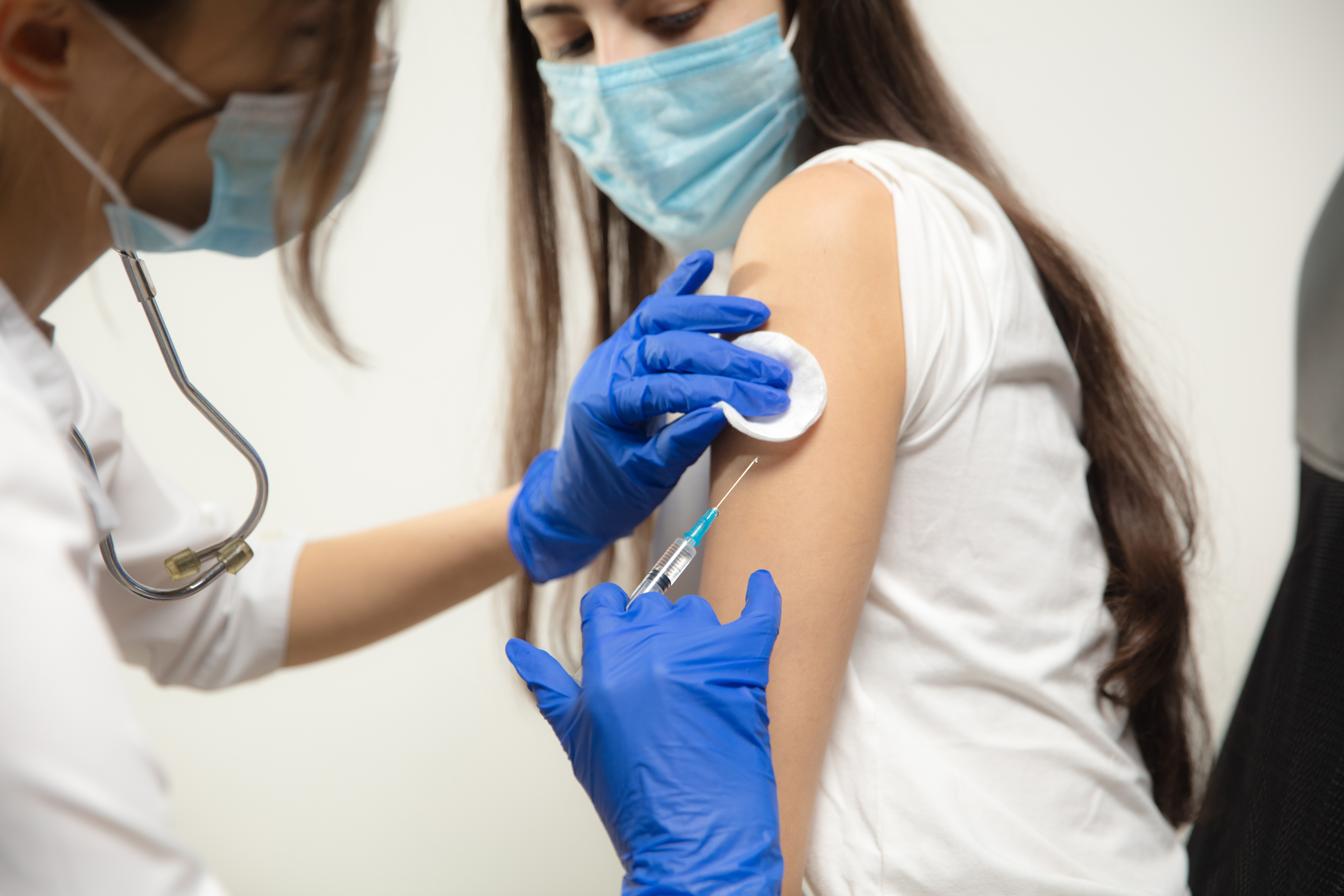 doctor-or-nurse-giving-vaccine-to-patient-using-the-syringe-injected-in-hospital-preparing-dose-in-needle-protection-against-coronavirus-covid-19-pandemic-and-pneumonia-healthcare-medicine (1).jpg
